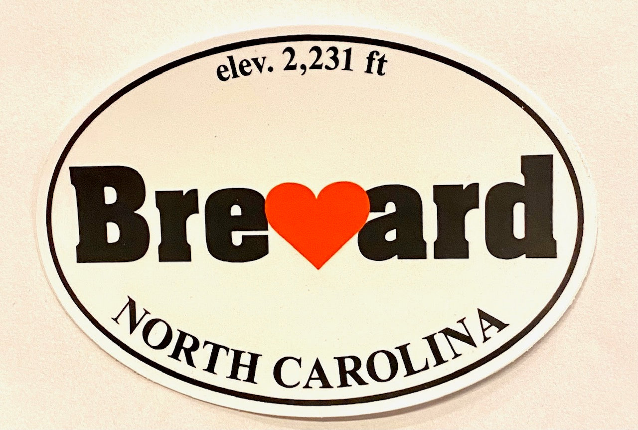 Oval white decal with the text 'I Love Brevard, North Carolina - Elevation 2,231 ft' with the name Brevard written in bold and a red heart replacing the 'v'.