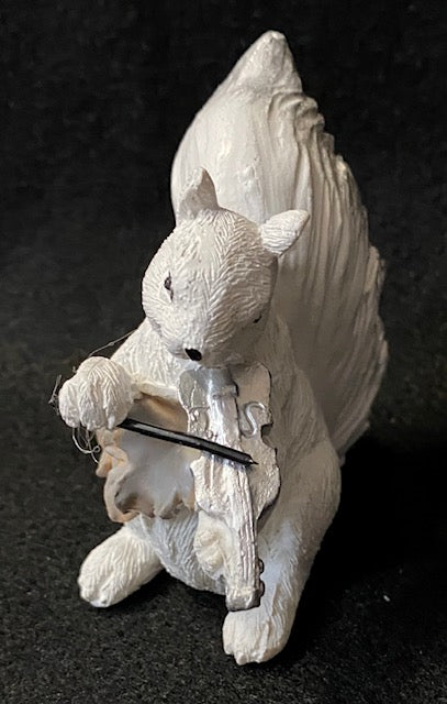 A hand painted white squirrel playing a violin resin figurine.