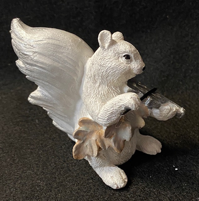 Side view of the white squirrel playing a violin hand painted resin figurine.