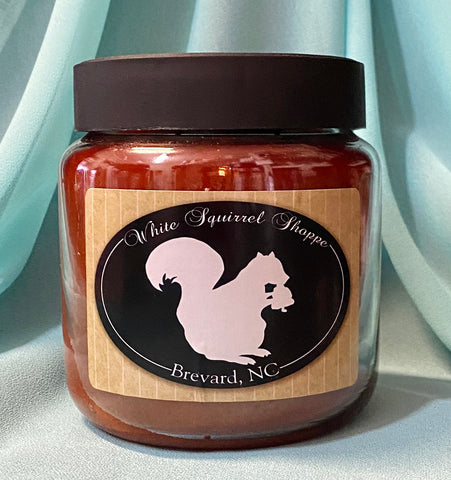 Candle - Buttered Maple Syrup and Mama's Sweet Tea Scent in a Jar labeled White Squirrel Shoppe Brevard, NC