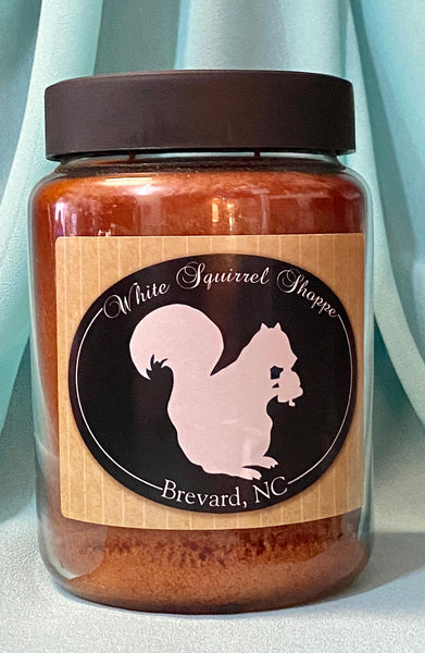 Candle - Buttered Maple Syrup and Mama's Sweet Tea Scent in a Jar labeled White Squirrel Shoppe Brevard, NC