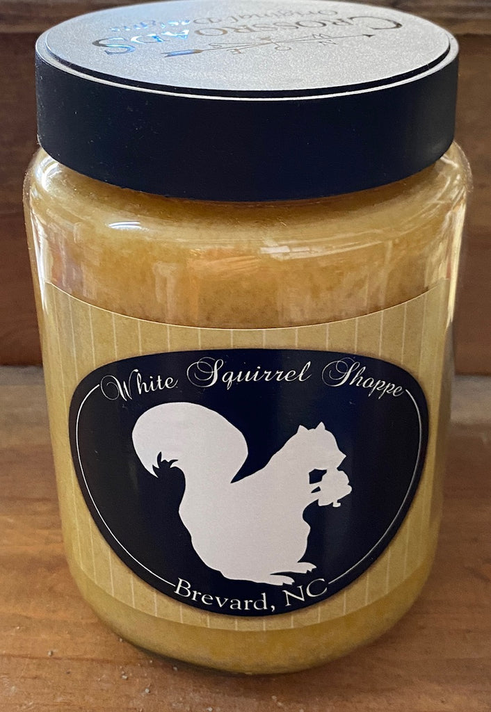 Candle - Dandelions and Sweet Grass in a Jar labeled White Squirrel Shoppe Brevard, NC