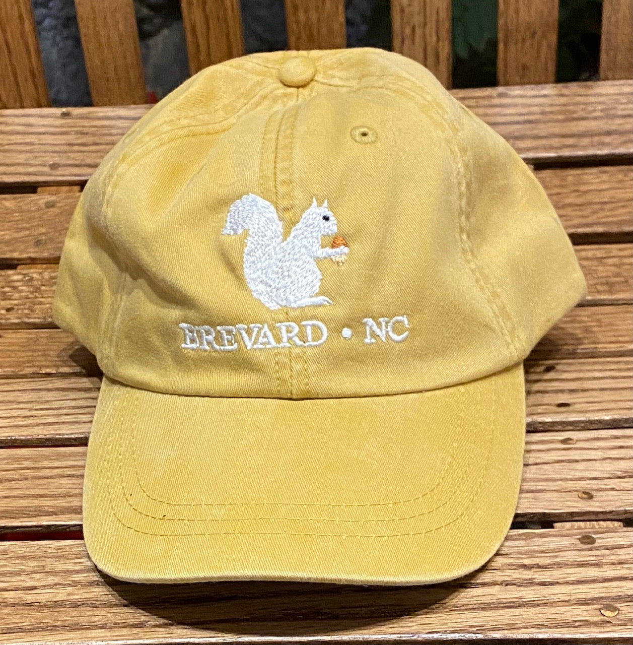 White Squirrel embroidered baseball cap from Brevard NC in chamois yellow color
