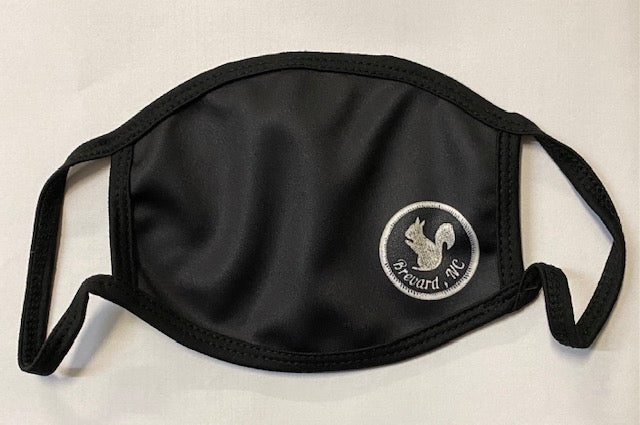 A black protective face mask with a screen-printed white squirrel logo on the front.