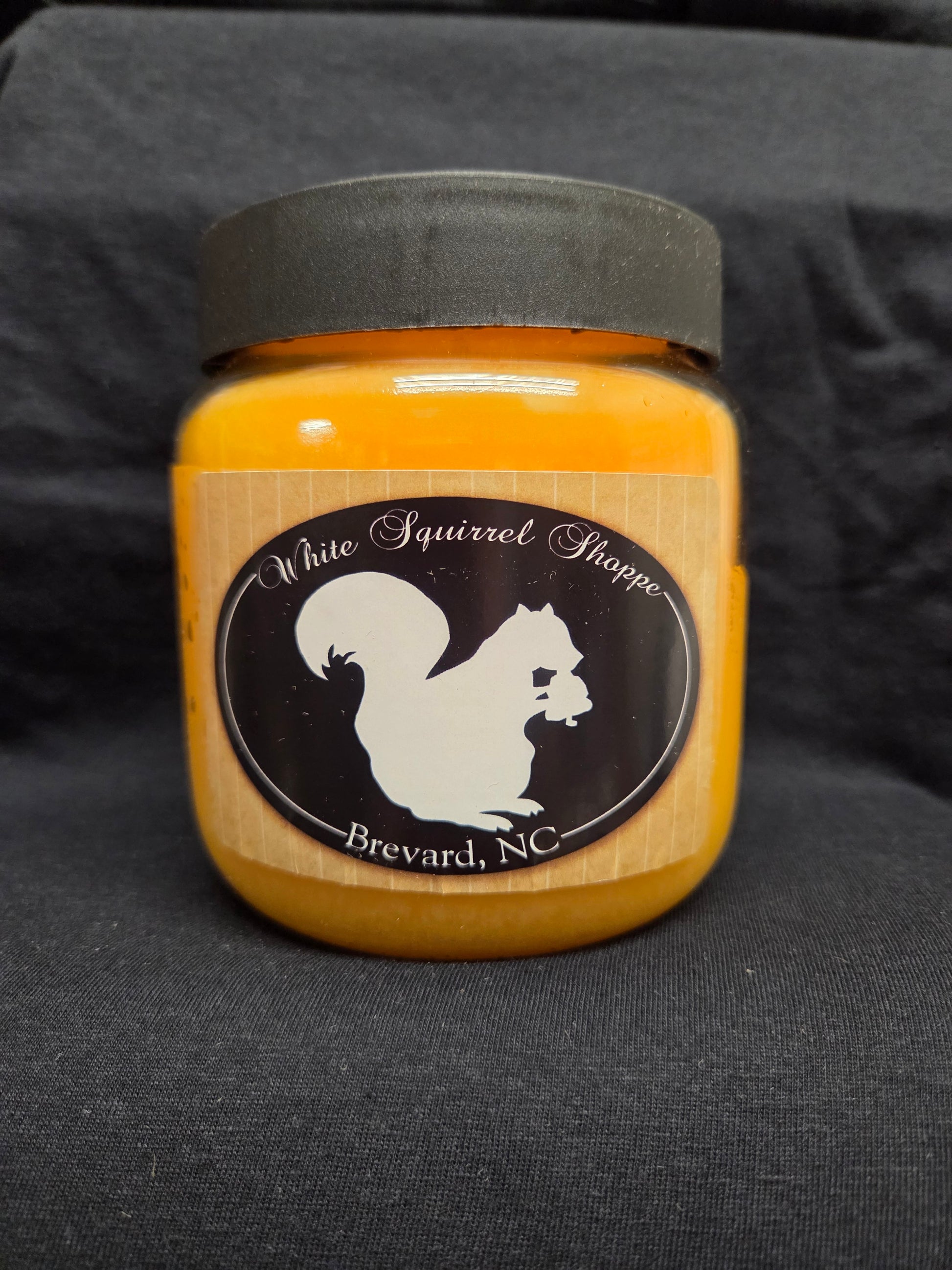Spiced Georgia Peach scented candle 16 oz in glass jar with White Squirrel Shoppe label