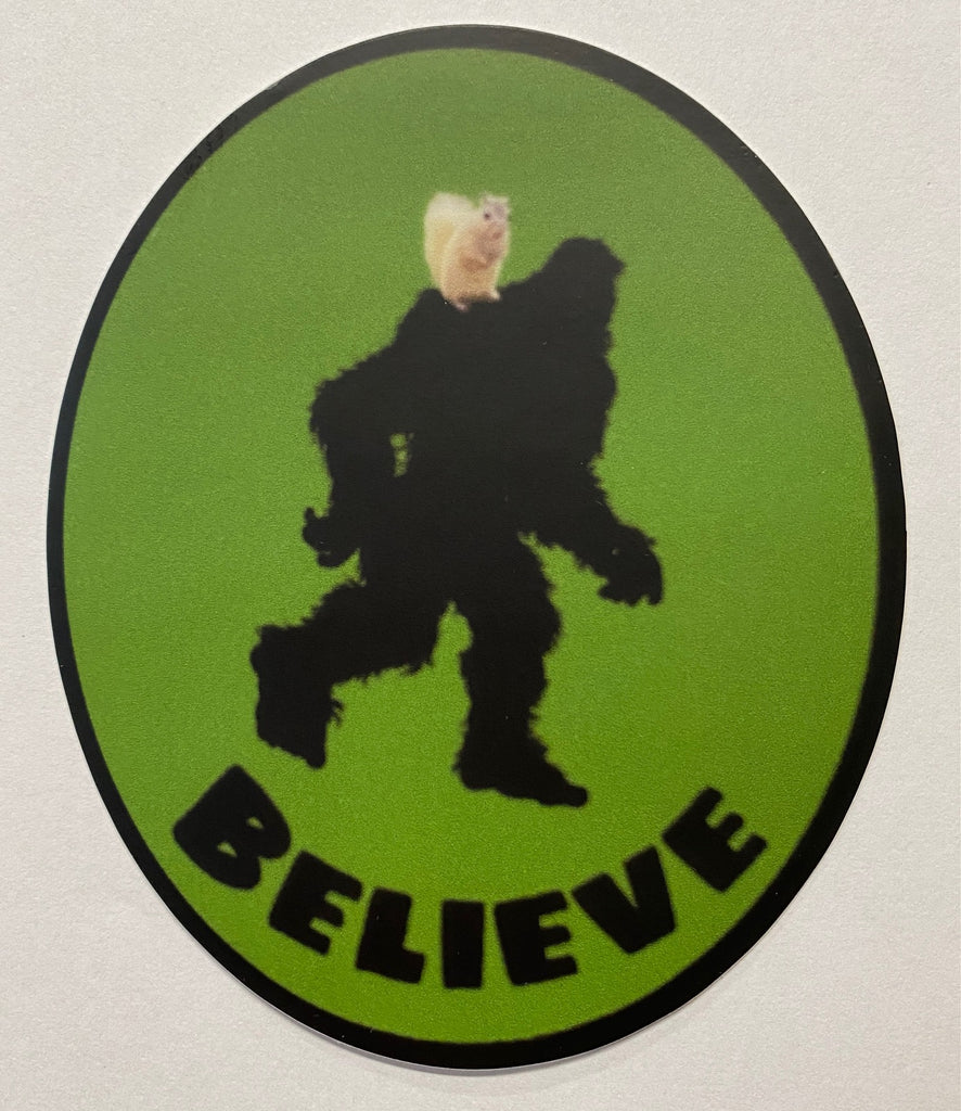 Decal - Big Foot (Sasquatch) with a white squirrel on his shoulder....."Believe" Oval Waterproof Vinyl Decal