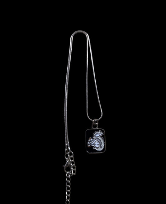 Jewelry - Necklace - White Squirrel Holding an Acorn on Black Background