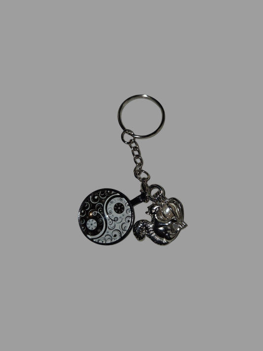 Keychain with decorative elements on a gray background