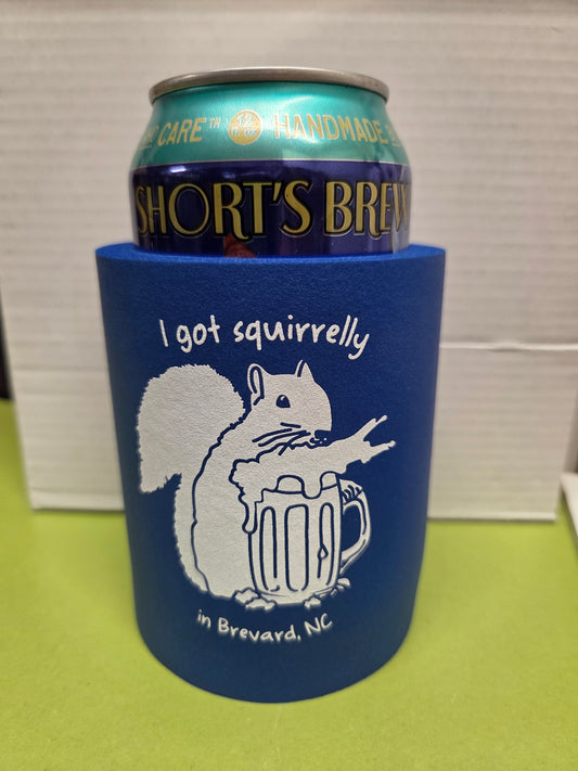 The Original Can Koozie with 'I got squirrelly in Brevard, NC. Features an image of our sweet white squirrel about to enjoy a pint himself.