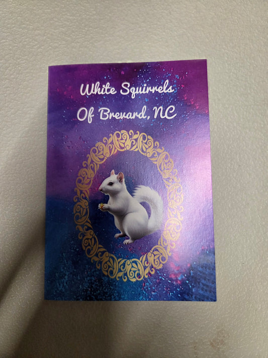 Card with a white squirrel illustration and text 'White Squirrels Of Brevard, NC' on a purple and blue gradient background.