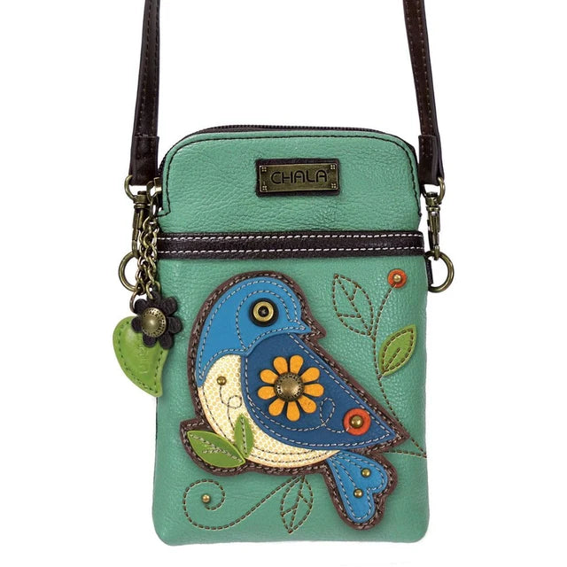 A mint green faux leather crossbody bag featuring a colorful embroidered bluebird and floral design on the front. The bag has a dark brown shoulder strap, a zippered top, and a metal brand plaque that reads 'CHALA'.