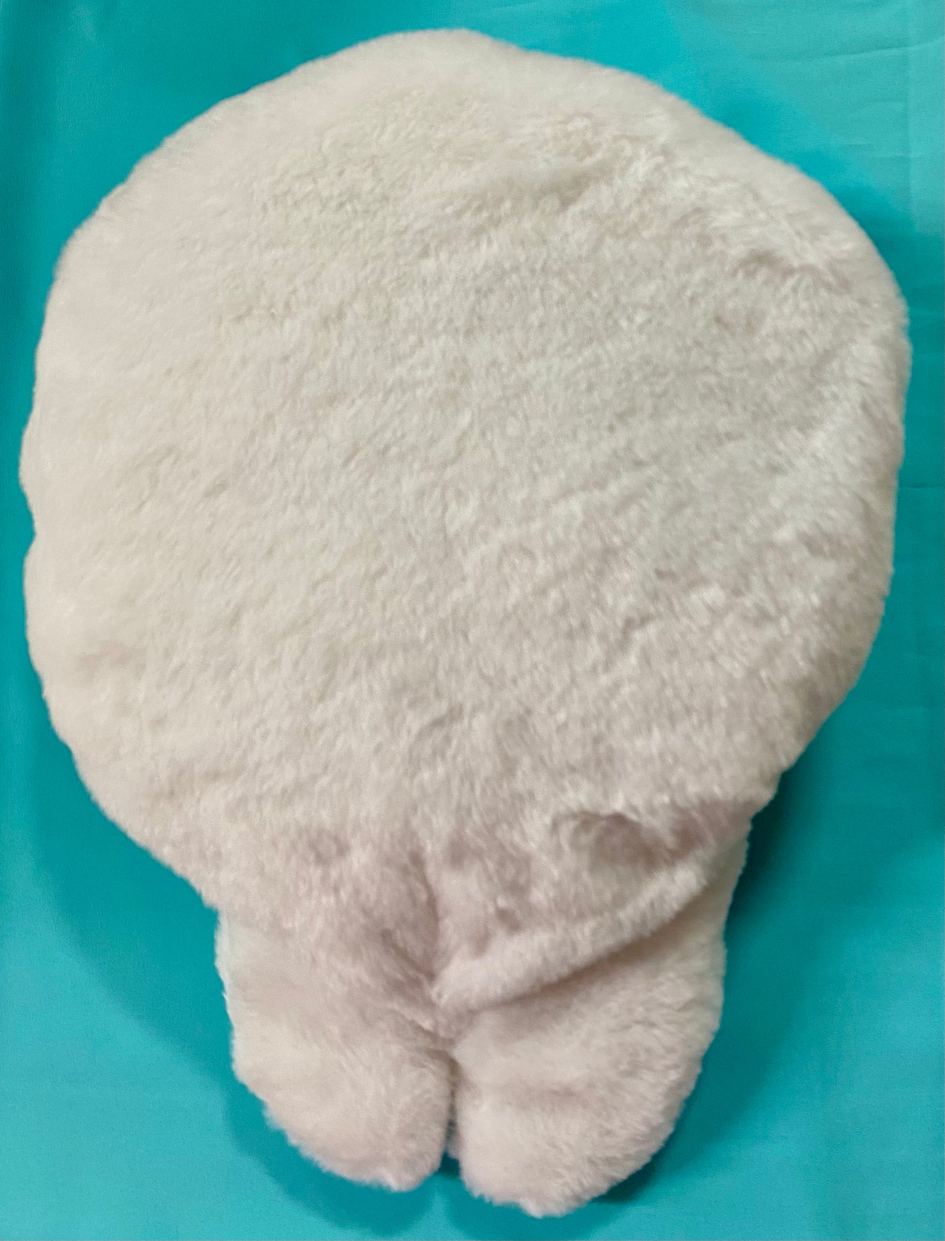 White squirrel plush warmie that holds a hot water bottle. Showing the back side o this adorable white squirrel.