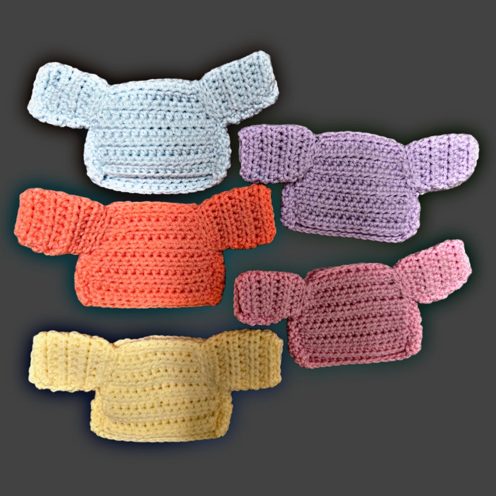 Collection of hand-crocheted squirrel sweaters in multiple colors showing variety available