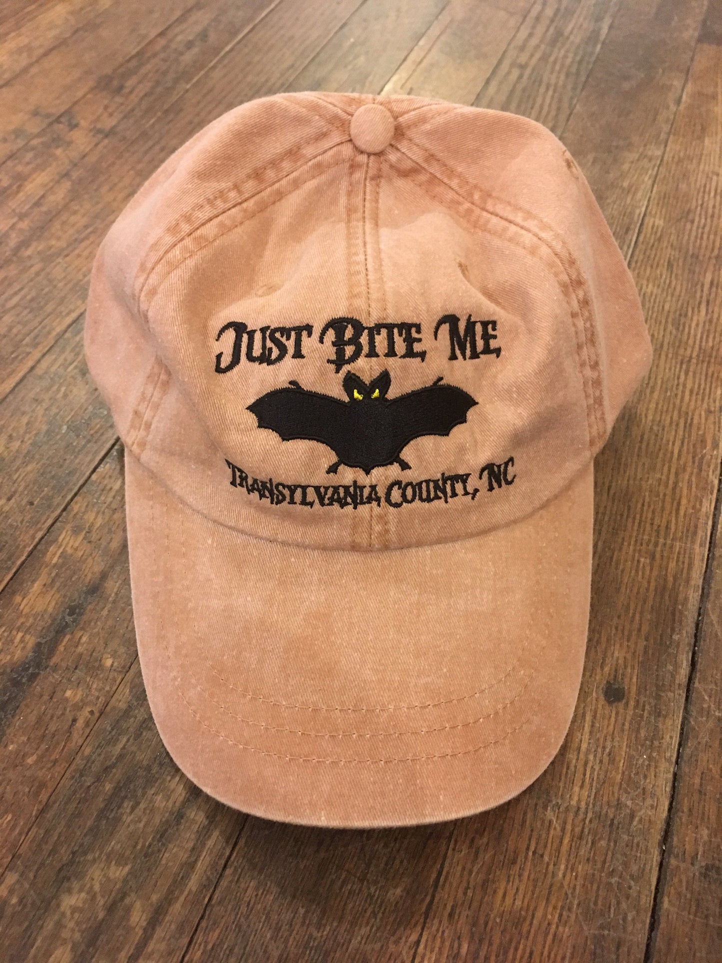 Baseball_Hat_with_Just_Bite_Me_and_Transylvania_County_in_Terra Cotta Color