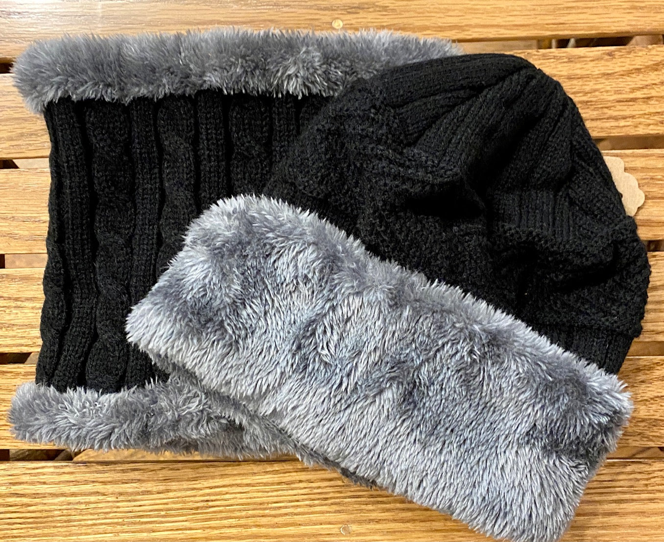 Cable knit beanie and neck warmer in black with gray aux fur detail.