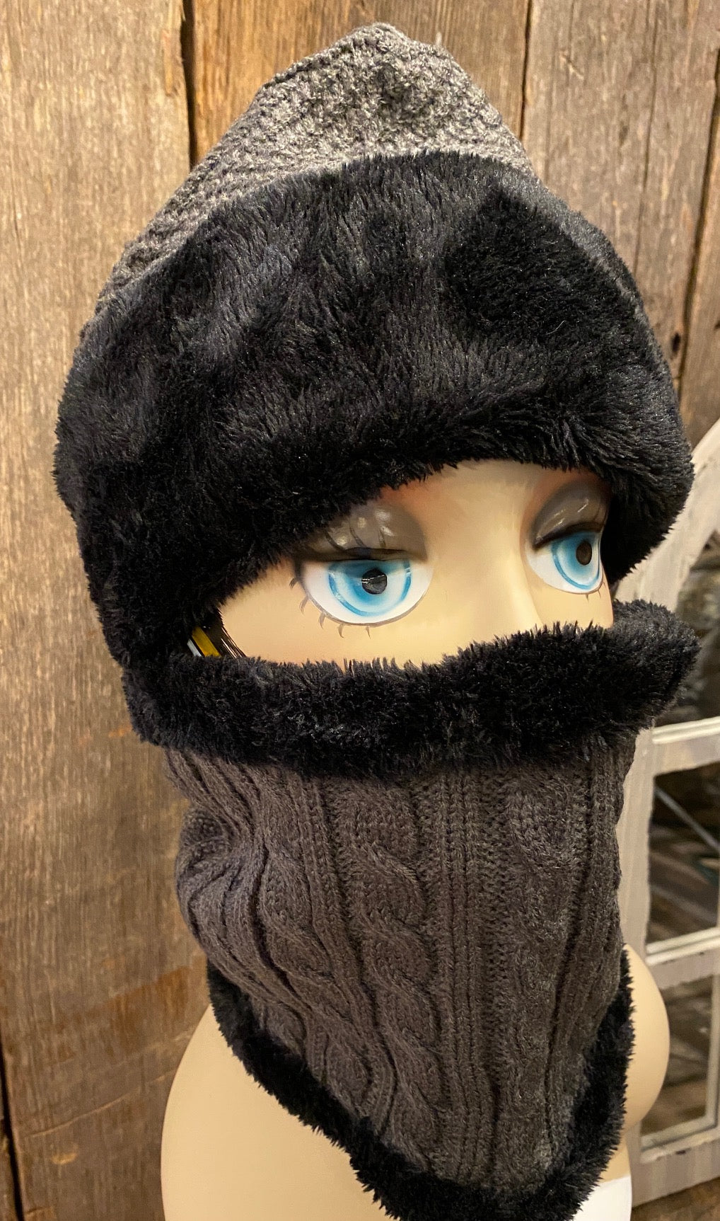 Cable knit beanie and neck warmer with fur detail in brown.