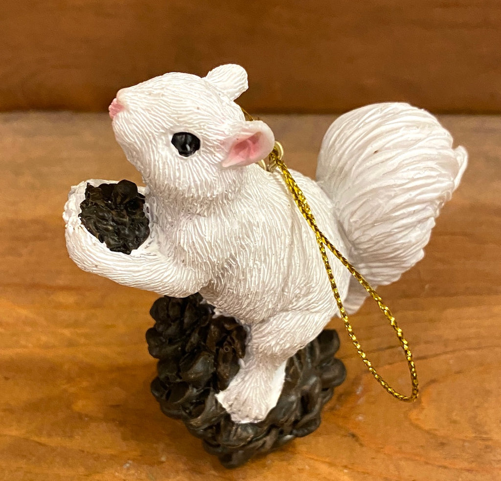 Ornament - White Squirrel Perched on a Pinecone or Acorn in Resin