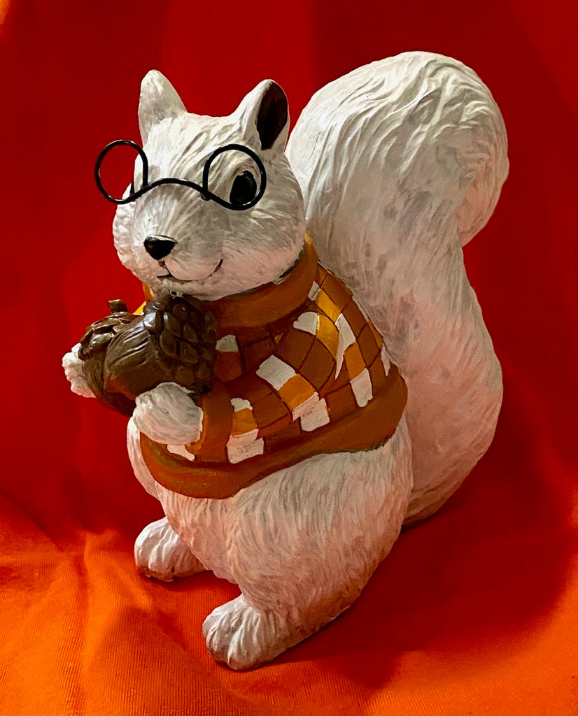 Figurine - White Squirrel With a Checkered Shirt Holding Acorns