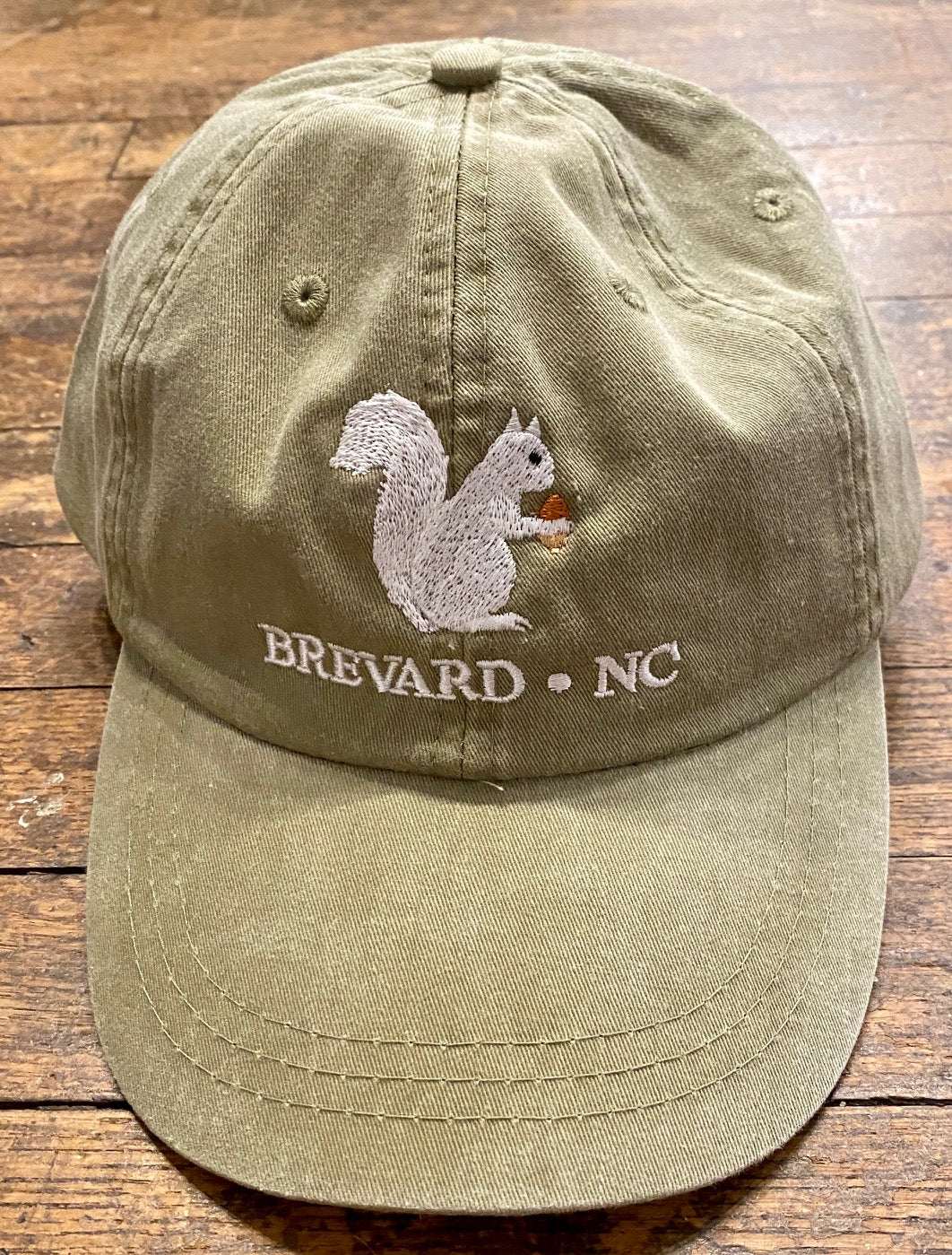 White Squirrel embroidered baseball cap from Brevard NC in khaki color