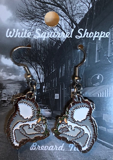 A pair of metal dangly white squirrel earrings.