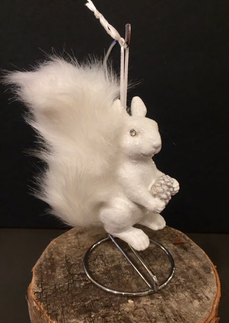 Sparkly white squirrel ornament with fluffy tail. Shown with loop to hang.