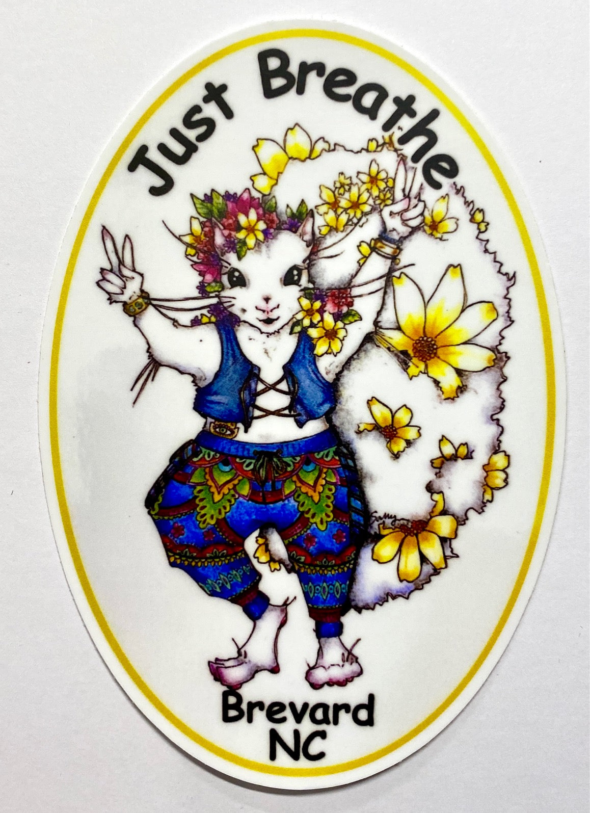 Oval decal with illustration of a white squirrel wearing a hippie girl costume with the text 'Just Breathe' and 'Brevard NC'.