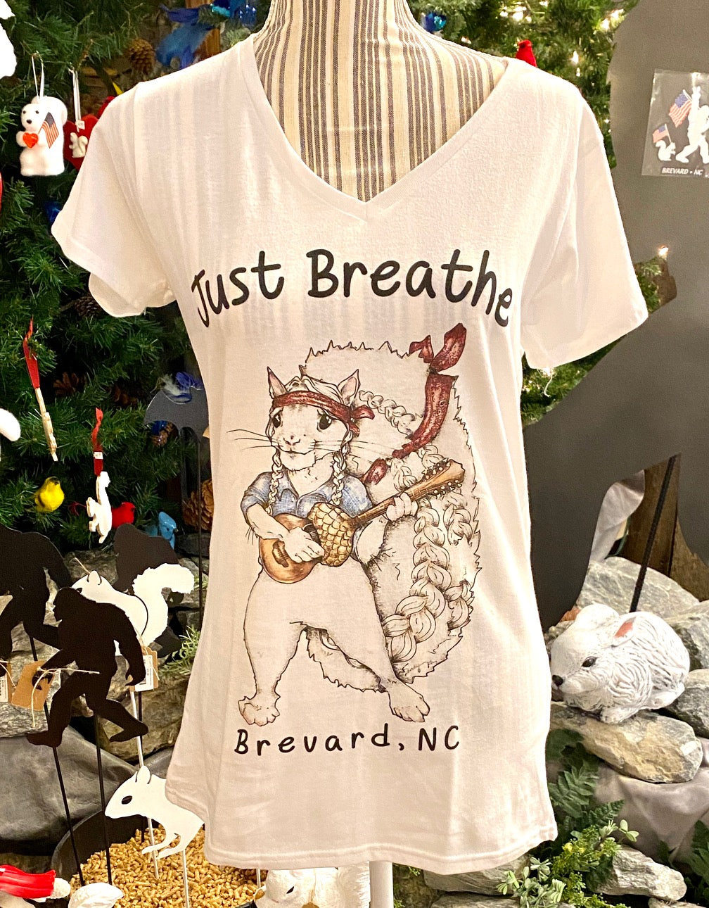 T_Shirt_Adult_Women_s_V_Neck_with_graphic_of_a_Willie_Nelson_white_squirrel_playing_an_acorn_guitar_Just_Breathe_Brevard_NC