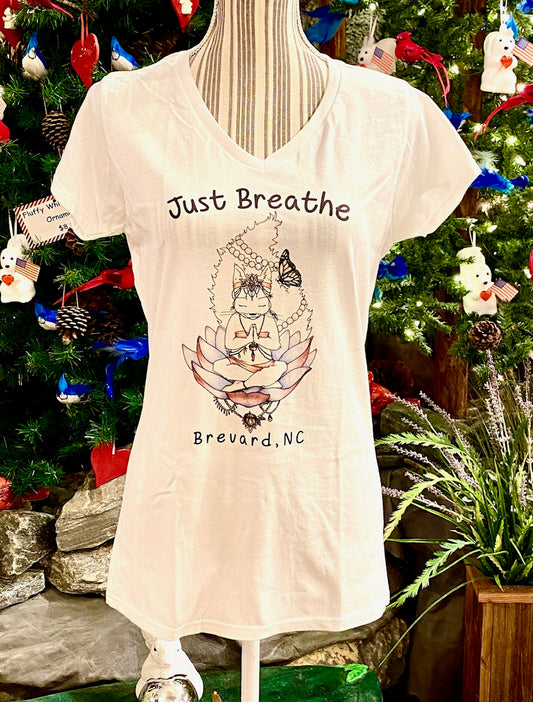 A white short sleeve fitted v-neck t-shirt for ladies with a graphic print of a white squirrel and the text 'Just Breathe Brevard, NC'.