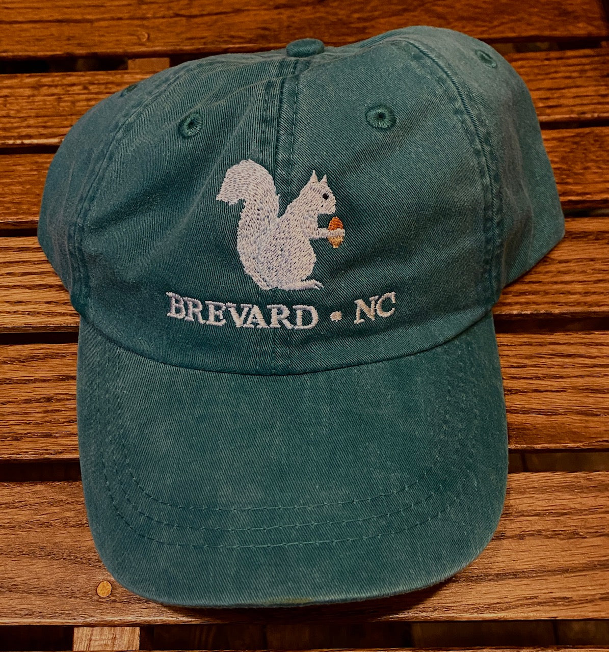White Squirrel embroidered baseball cap from Brevard NC in forest green color