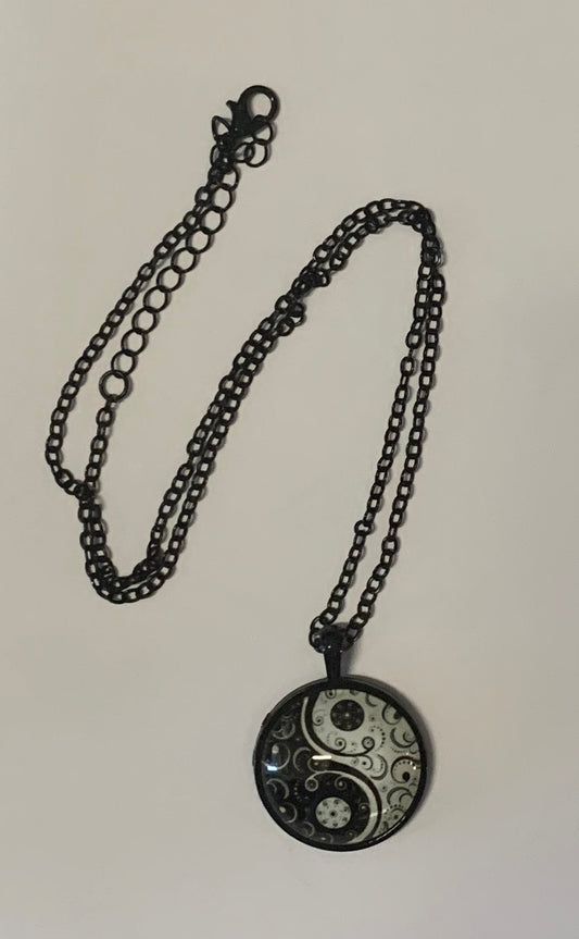 Yin Yang glow-in-the-dark pendant necklace on 18-inch chain black design.