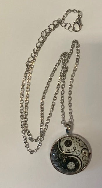 Yin Yang glow-in-the-dark pendant necklace on 18-inch chain silver alloy design.